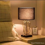 Lampe moderne dorée et noire